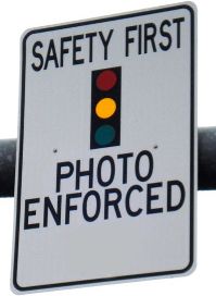 traffic sign reading safety first photo enforced