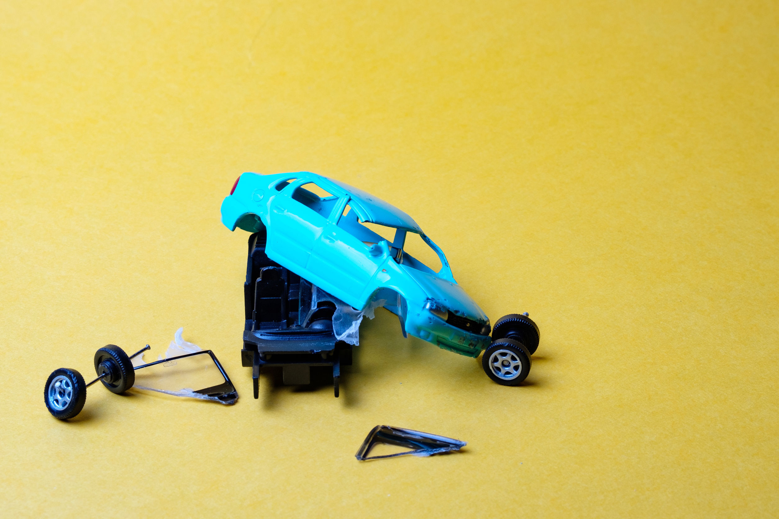 Child's toy car broken into pieces