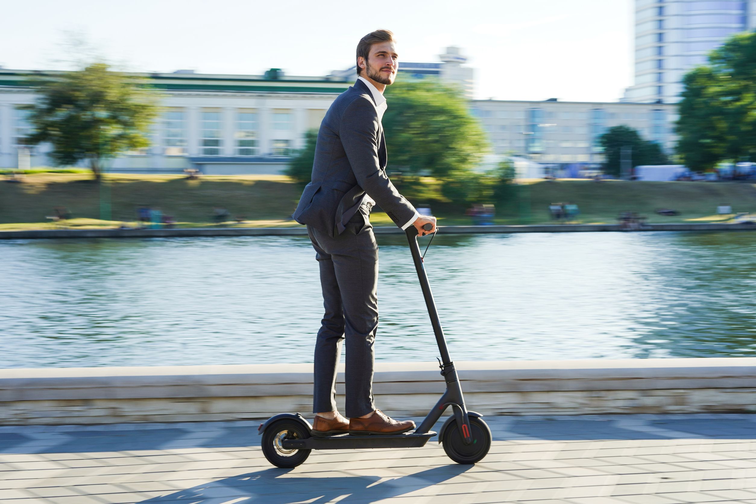 Business man on e-scooter