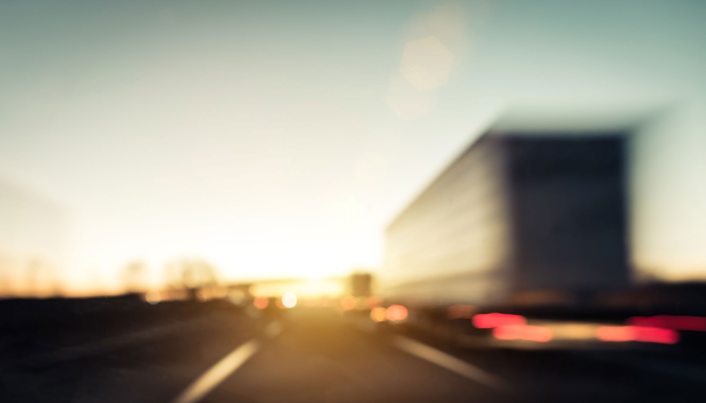 18-wheeler zooms past driver on interstate