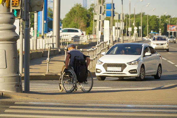 wheelchair person on sidewalk