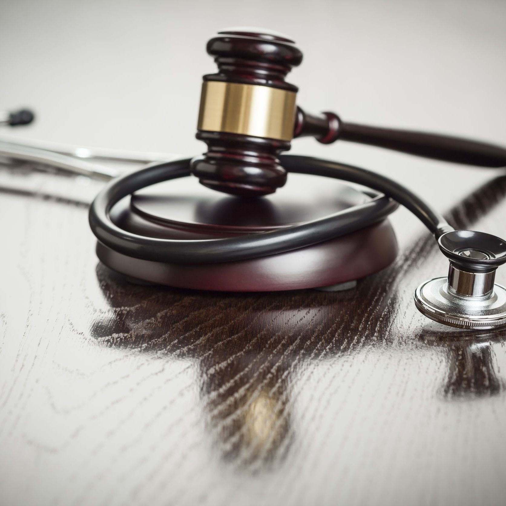 Gavel and Stethoscope on a Table