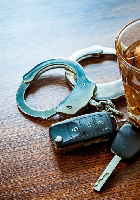 Whiskey with Car Keys and Handcuffs from DUI